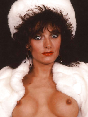 18 year old female Doris G slips off her underwear to pose naked on her bed